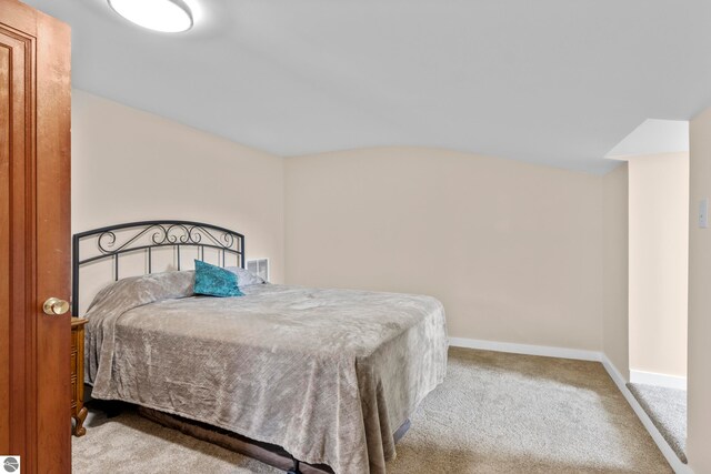 7256 Highland Dr, Beulah, MI 49617 - carpeted bedroom featuring baseboards