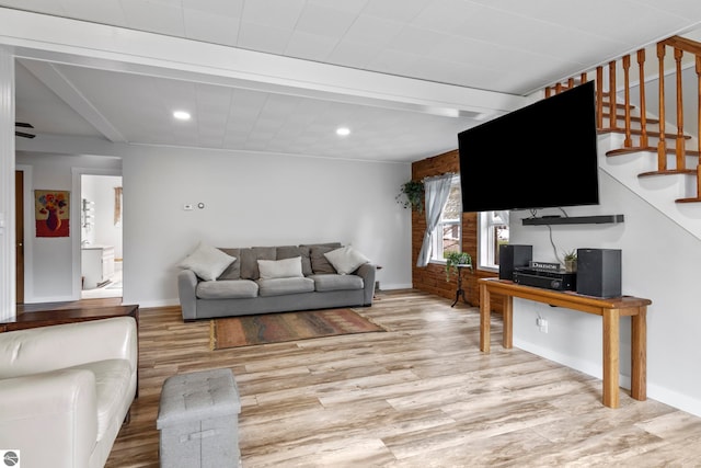 7256 Highland Dr, Beulah, MI 49617 - living area with light wood finished floors, stairs, baseboards, and recessed lighting