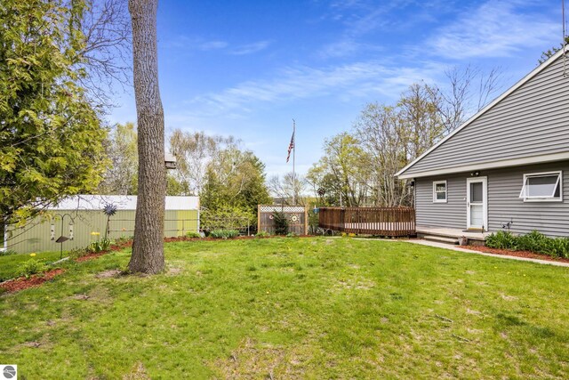 7256 Highland Dr, Beulah, MI 49617 - view of yard featuring a wooden deck