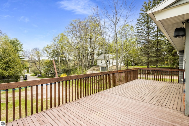 7256 Highland Dr, Beulah, MI 49617 - wooden deck featuring view of wooded area