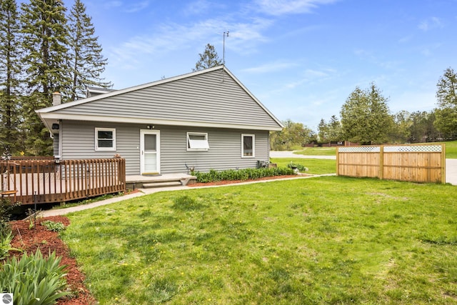 7256 Highland Dr, Beulah, MI 49617 - back of property featuring a deck and a yard