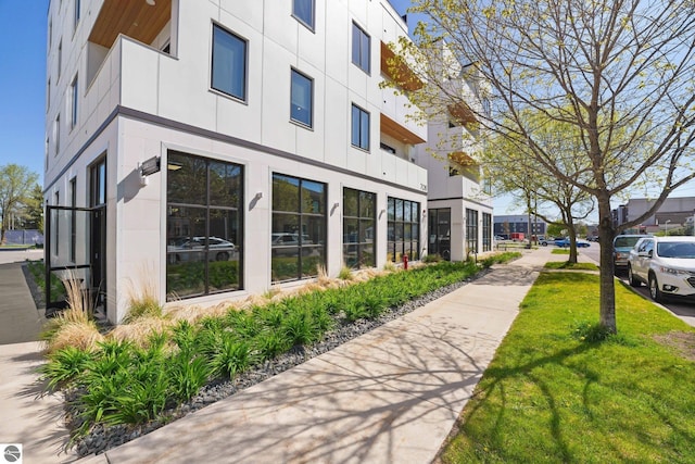 708 Randolph St Unit 204, Traverse City, MI 49684 - view of side of property featuring a yard