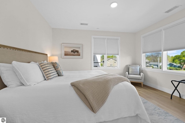 708 Randolph St Unit 204, Traverse City, MI 49684 - bedroom with light wood-style flooring and baseboards
