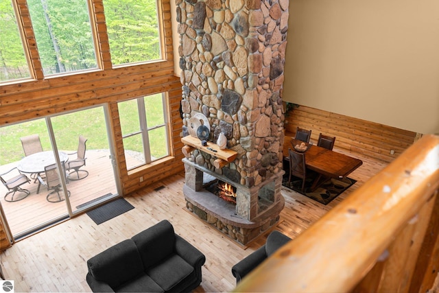 5592 Troon N, Bellaire, MI 49615 - living room featuring wood-type flooring, a fireplace, and a high ceiling