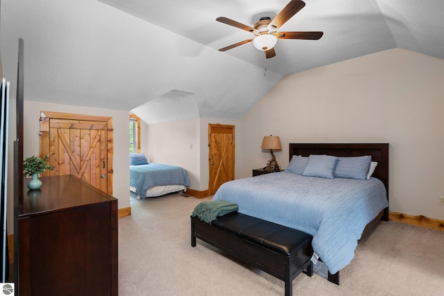 5592 Troon N, Bellaire, MI 49615 - carpeted bedroom with vaulted ceiling, baseboards, and a ceiling fan