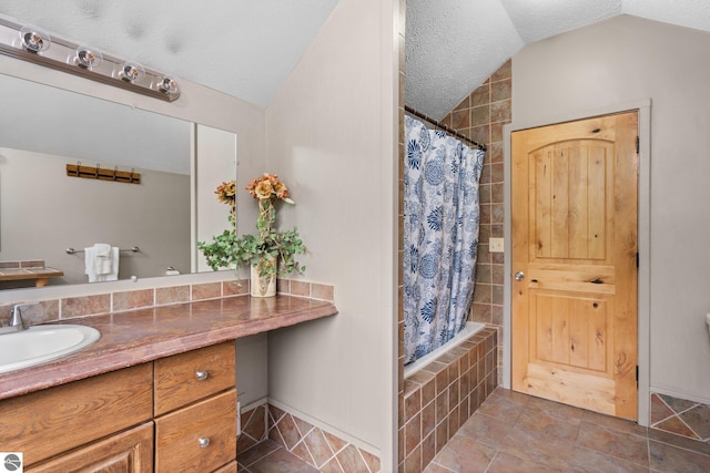 5592 Troon N, Bellaire, MI 49615 - bathroom with lofted ceiling, vanity, baseboards, and tiled shower / bath combo