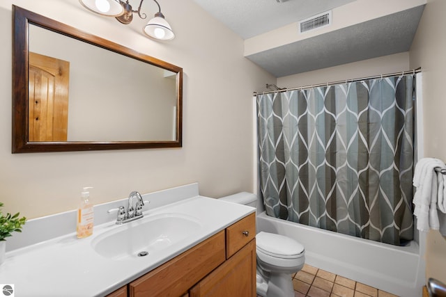 5592 Troon N, Bellaire, MI 49615 - bathroom with vanity, toilet, shower / bathtub combination with curtain, tile patterned flooring, and a textured ceiling