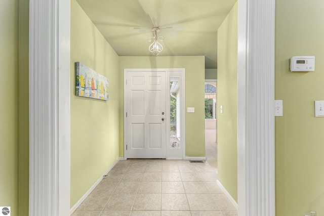 6647 E Harbor Dr, Elk Rapids, MI 49629 - foyer entrance featuring baseboards and light tile patterned floors
