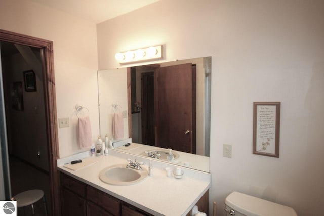 161 Huntinghorn Dr, Roscommon, MI 48653 - bathroom featuring toilet and vanity