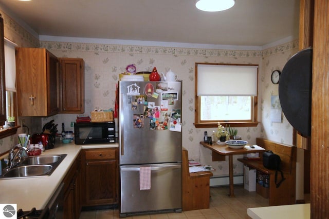 161 Huntinghorn Dr, Roscommon, MI 48653 - kitchen with black appliances, wallpapered walls, baseboard heating, light countertops, and a sink