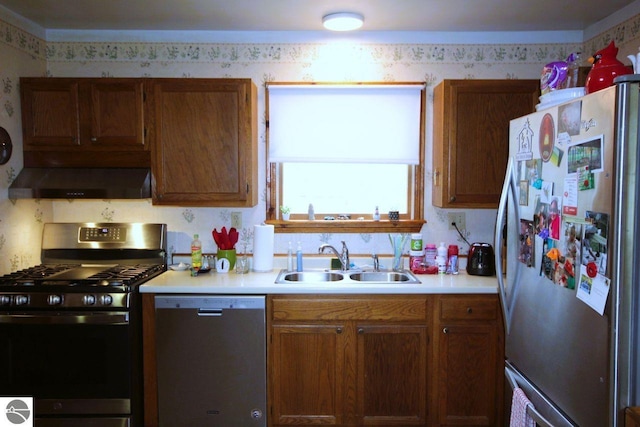 161 Huntinghorn Dr, Roscommon, MI 48653 - kitchen featuring appliances with stainless steel finishes, ventilation hood, a sink, wallpapered walls, and light countertops