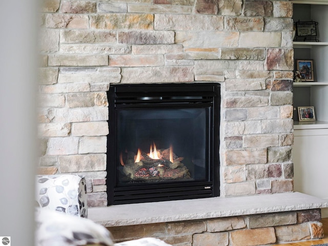 5199 Stonefield Dr Unit 13, Traverse City, MI 49684 - detailed view of a lit fireplace