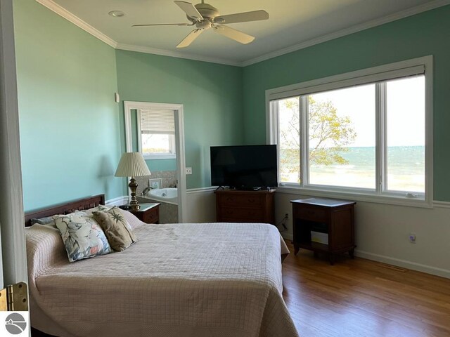463 S Otis Ln, Au Gres, MI 48703 - bedroom with wood finished floors, crown molding, baseboards, and a ceiling fan