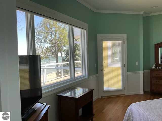 463 S Otis Ln, Au Gres, MI 48703 - bedroom with wood finished floors, crown molding, and baseboards