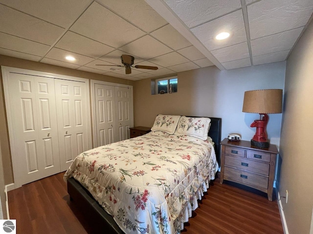 463 S Otis Ln, Au Gres, MI 48703 - bedroom with dark wood-style floors, two closets, a ceiling fan, recessed lighting, and a drop ceiling