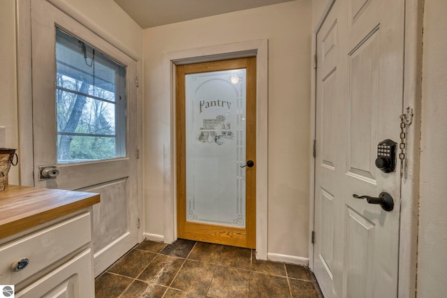 310 W Broadway, Suttons Bay, MI 49682 - doorway to outside with baseboards