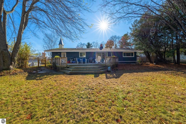 310 W Broadway, Suttons Bay, MI 49682 - back of property featuring a wooden deck