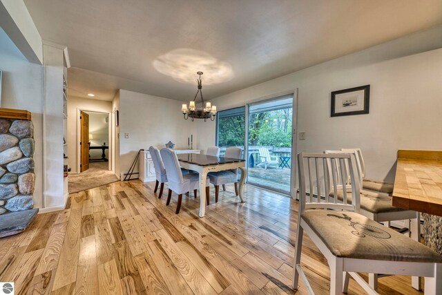 310 W Broadway, Suttons Bay, MI 49682 - dining room featuring light wood-style floors, a chandelier, and recessed lighting