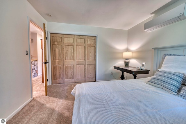 310 W Broadway, Suttons Bay, MI 49682 - bedroom with a wall mounted air conditioner, carpet flooring, a closet, and baseboards
