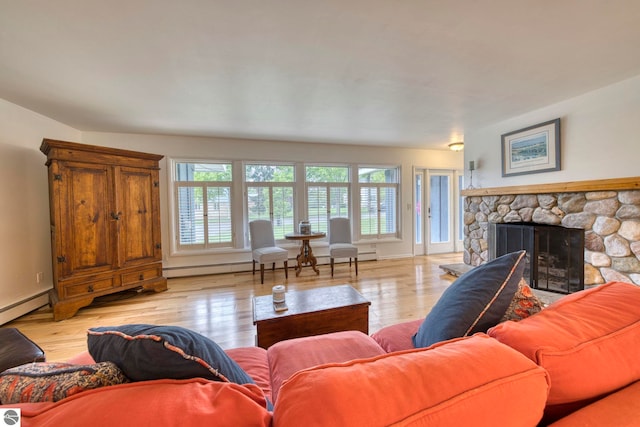 310 W Broadway, Suttons Bay, MI 49682 - living area featuring a fireplace, light wood-type flooring, and baseboards