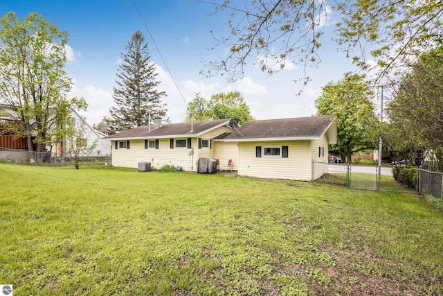 8695 S Maple City Rd, Maple City, MI 49664 - rear view of house featuring central AC unit