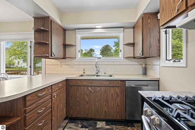 8695 S Maple City Rd, Maple City, MI 49664 - kitchen with open shelves, appliances with stainless steel finishes, a sink, light countertops, and tasteful backsplash