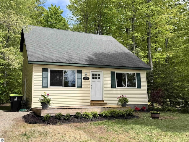 4872 E Shore Dr NE, Kalkaska, MI 49646 - view of front of house featuring entry steps and roof with shingles