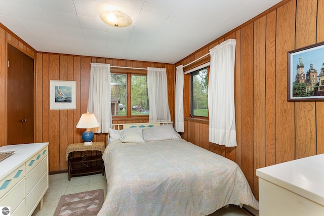 4645 Lakeview Dr, Hale, MI 48739 - bedroom with wood walls and light floors