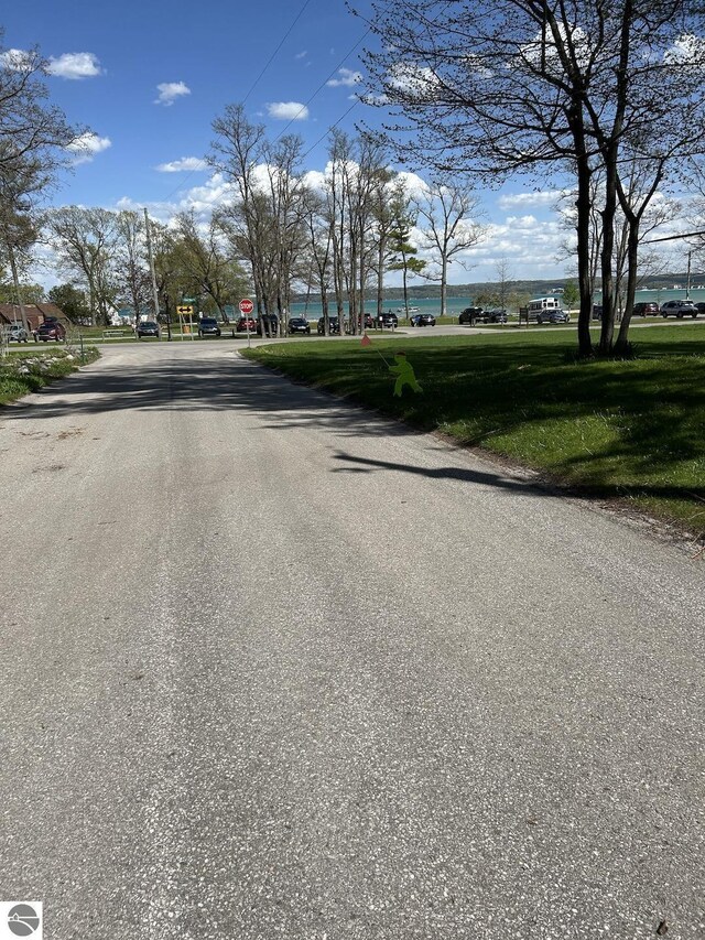 302 Huron St, Traverse City, MI 49686 - view of asphalt road with traffic signs