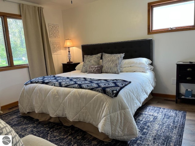 302 Huron St, Traverse City, MI 49686 - bedroom with wood finished floors and baseboards