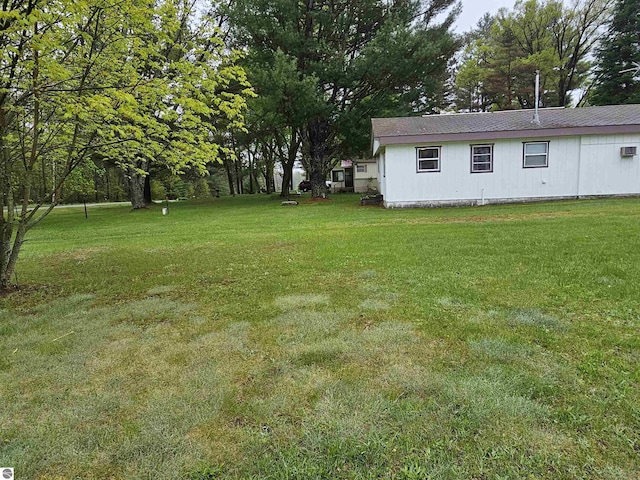 3058 Brodie Rd, South Branch, MI 48761 - view of green lawn featuring view of wooded area