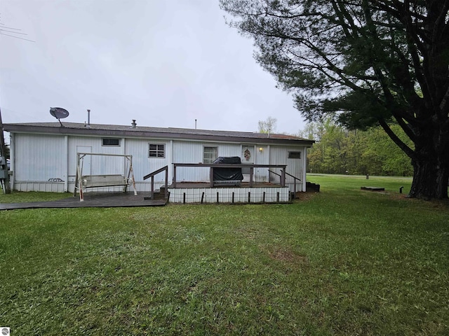 3058 Brodie Rd, South Branch, MI 48761 - rear view of house featuring a yard and a wooden deck