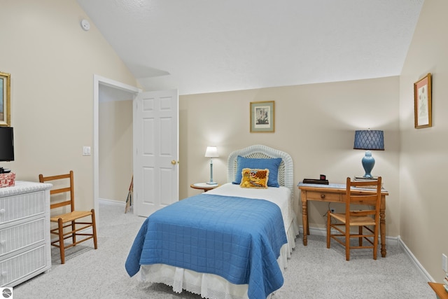 6200 Single Tree Ln, Williamsburg, MI 49690 - bedroom featuring lofted ceiling, carpet floors, and baseboards