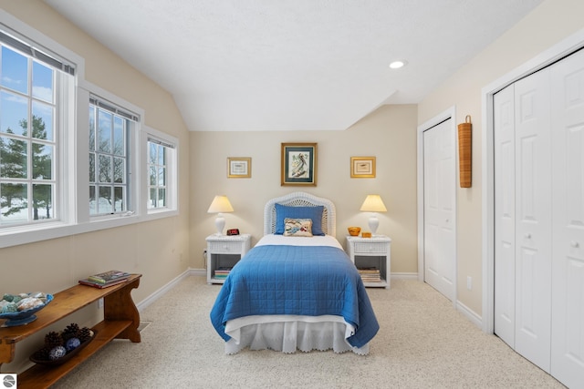 6200 Single Tree Ln, Williamsburg, MI 49690 - carpeted bedroom with baseboards, recessed lighting, and two closets