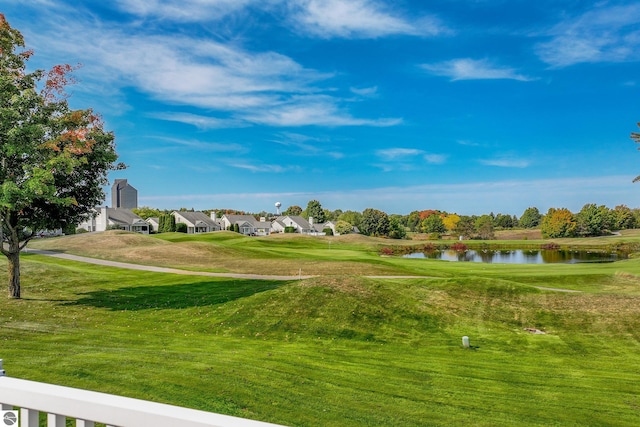 6200 Single Tree Ln, Williamsburg, MI 49690 - view of property's community with a water view, a lawn, and view of golf course