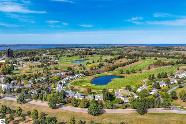 6200 Single Tree Ln, Williamsburg, MI 49690 - aerial perspective of suburban area with a nearby body of water and a golf club