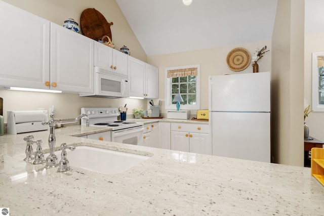 6200 Single Tree Ln, Williamsburg, MI 49690 - kitchen with white appliances, lofted ceiling, light stone countertops, white cabinets, and a sink