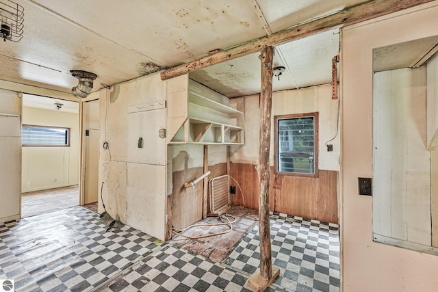 1151 N 8 Mile Rd, Lake City, MI 49651 - interior space with tile patterned floors and wood walls
