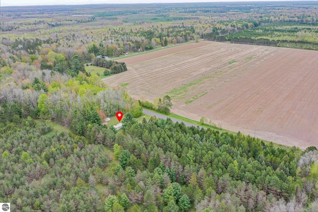 1151 N 8 Mile Rd, Lake City, MI 49651 - aerial overview of property's location with rural landscape, a heavily wooded area, and extensive farmland