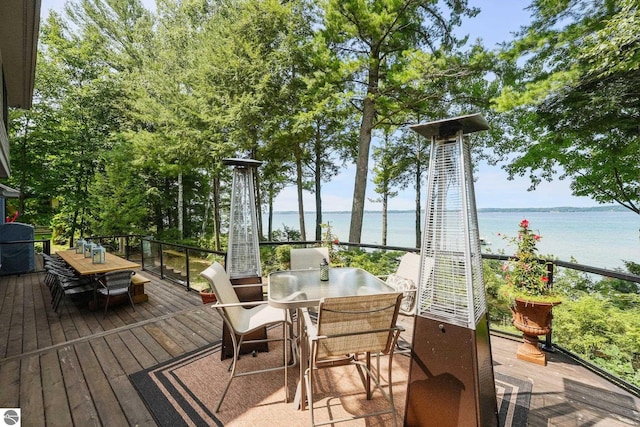 4283 Maitland Rd, Williamsburg, MI 49690 - deck with outdoor dining area and a water view