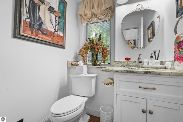 4283 Maitland Rd, Williamsburg, MI 49690 - bathroom with vanity, toilet, and baseboards