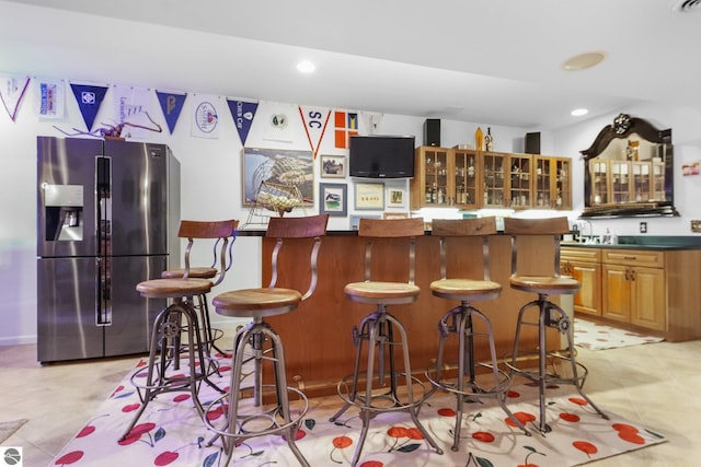 4283 Maitland Rd, Williamsburg, MI 49690 - indoor wet bar featuring stainless steel refrigerator with ice dispenser and recessed lighting