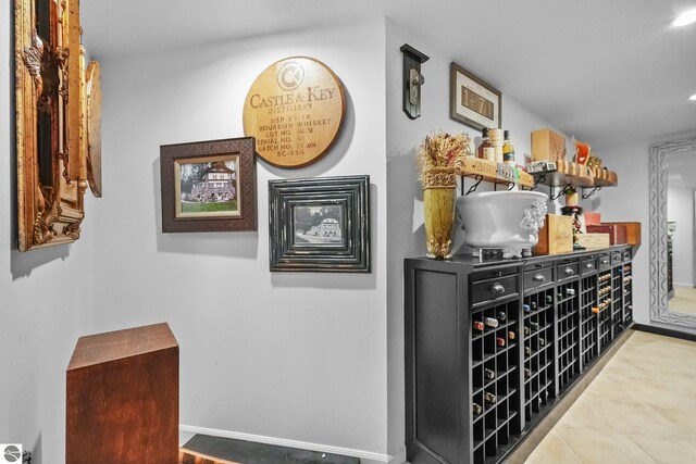 4283 Maitland Rd, Williamsburg, MI 49690 - bar area with tile patterned floors and baseboards