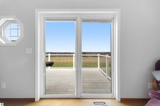 2769 White Rd, Frankfort, MI 49635 - doorway to outside featuring light wood-style floors