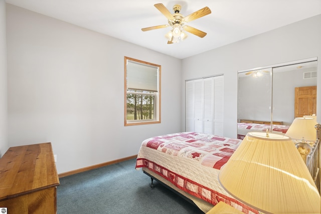 2769 White Rd, Frankfort, MI 49635 - bedroom with multiple closets, carpet floors, baseboards, and ceiling fan