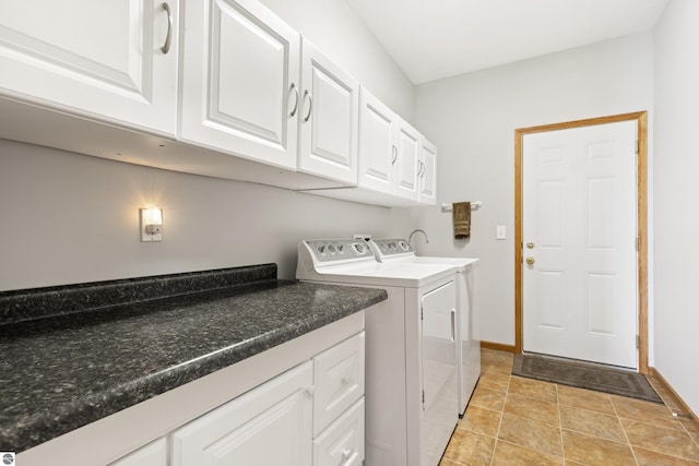 2769 White Rd, Frankfort, MI 49635 - laundry room with washer and dryer, cabinet space, and baseboards
