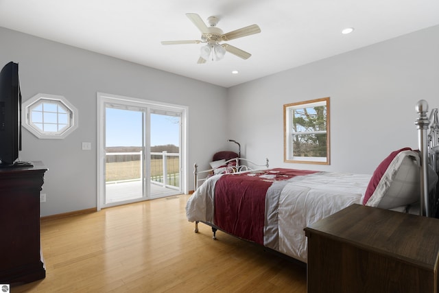 2769 White Rd, Frankfort, MI 49635 - bedroom featuring access to exterior, light wood-style flooring, multiple windows, recessed lighting, and a ceiling fan