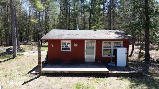 6031 Collins Rd, Onaway, MI 49765 - view of outdoor structure featuring a view of trees
