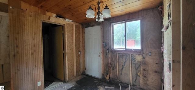6031 Collins Rd, Onaway, MI 49765 - doorway to outside with a chandelier