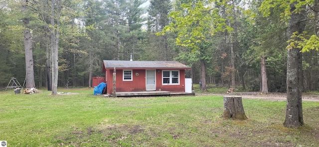 6031 Collins Rd, Onaway, MI 49765 - view of outdoor structure featuring a view of trees